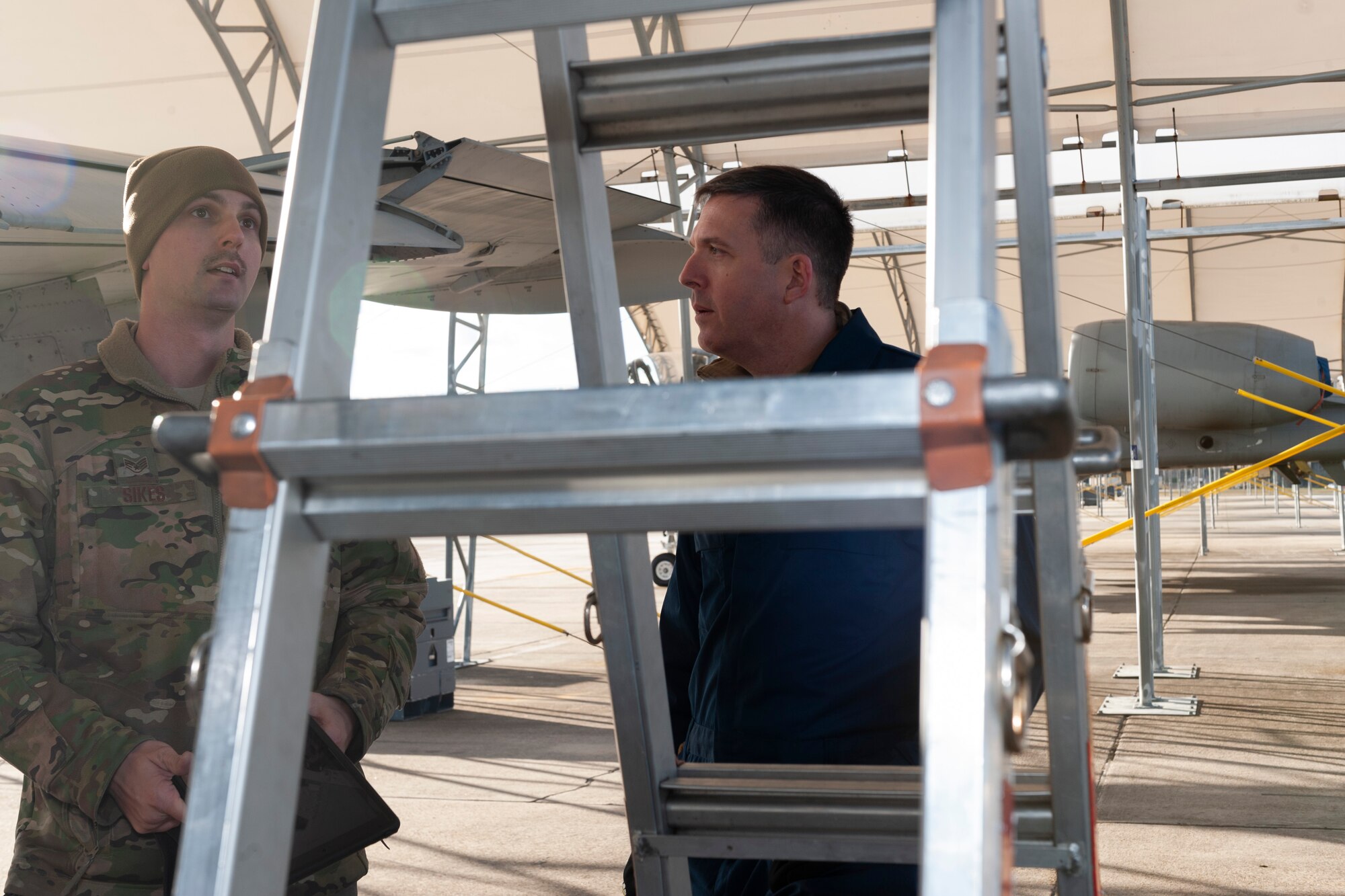 Photo of Airman talking to Col. Walls