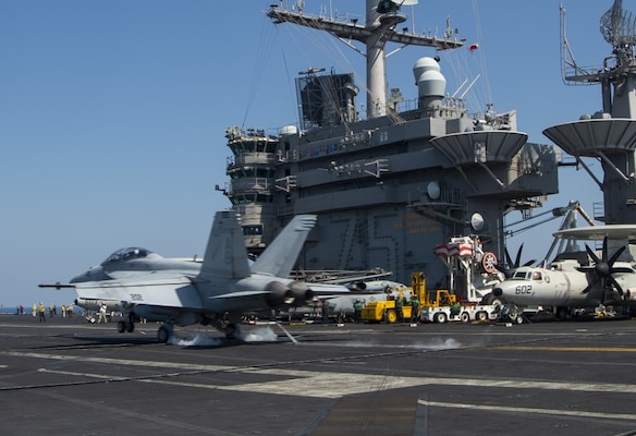 An F/A-18F Super Hornet, attached to the Fighting Checkmates of Strike Fighter Squadron (VFA) 211, lands on the flight deck of the aircraft carrier USS Harry S. Truman (CVN 75) in the Arabian Sea Feb. 1, 2020. The Harry S. Truman Carrier Strike Group is deployed to the U.S. 5th Fleet area of operations in support of naval operations to ensure maritime stability and security in the Central Region, connecting the Mediterranean and the Pacific through the western Indian Ocean and three strategic choke points. (U.S. Navy photo by Mass Communication Specialist 3rd Class Benjamin Waddell)