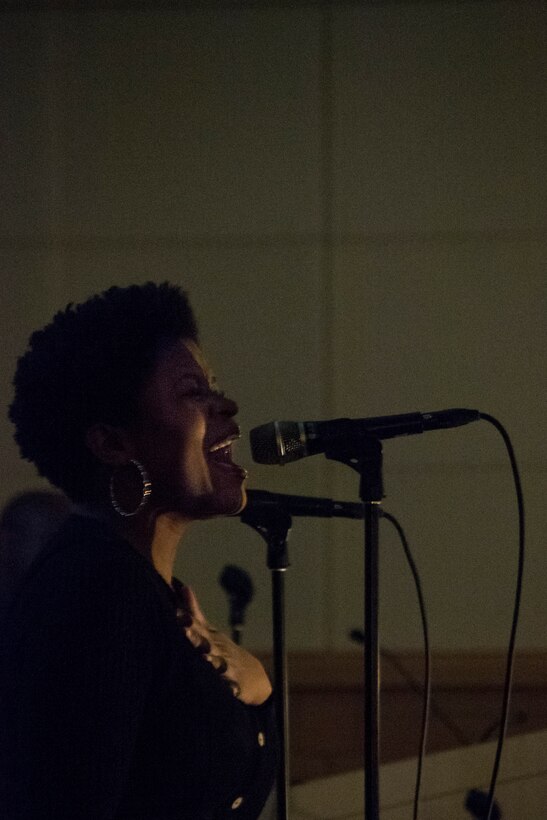 Shelia Moser, Key Arts Productions entertainer, sings Rise Up, by Andra Day, during the African American History Month event Feb. 12 in Philadelphia. The event celebrated African Americans through a multimedia presentation that included video, slideshows, narration and live music.