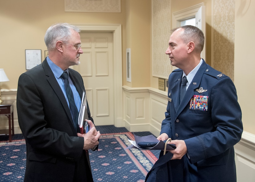 Marcus J. Beauregard, Defense-State Liaison Office director, speaks with Col. Andrew Purath, 11th Wing and Joint Base Andrews Commander, after testifying on Senate Bill 280 at the Education, Health and Environmental Affairs Committee hearing in Annapolis, Md., Feb. 6, 2020. Senate Bill, Occupational and Professional Licensing - Service Members, Veterans, and Military Spouses - Revisions to Reciprocity Requirements, allows for a permanent solution to service members, veterans, and military spouse with out-of-state licenses who wish to work in the Maryland. This bill is a part of the Defense-State Liaison Office’s plan to eliminate the Barriers to license portability experience by military spouses. (U.S. Air Force photo by Staff Sgt. Jared Duhon)