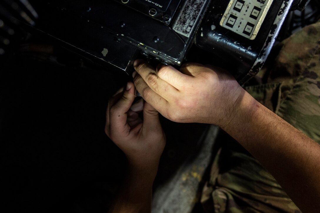 A photo of an unscrewing a bolt.