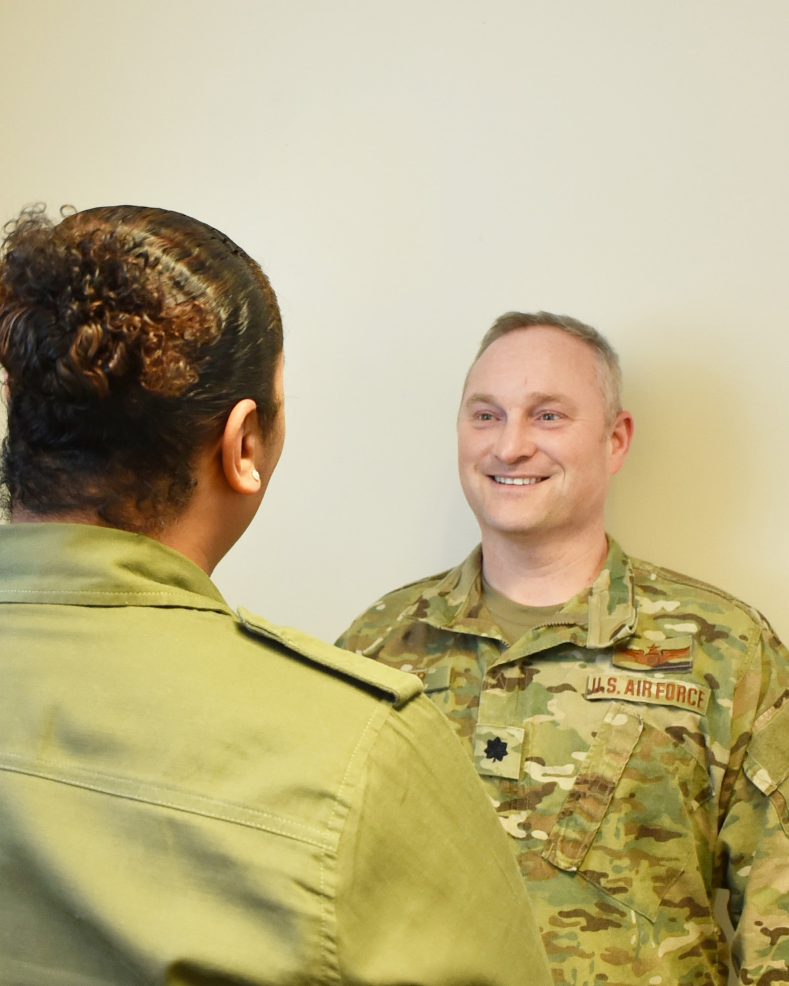 Lt. Col. Matt Basler. 931st Mission Support Group director, speaks with Shewanna Keyes, 22nd Mission Support Group executive assistant Feb. 13, 2020, at McConnell Air Force Base, Kan.  Basler, a former leadership consultant at the Air Force Profession of Arms Center of Excellence, stepped into the director role this past December.