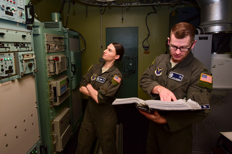 Two Airmen working in a launch facility