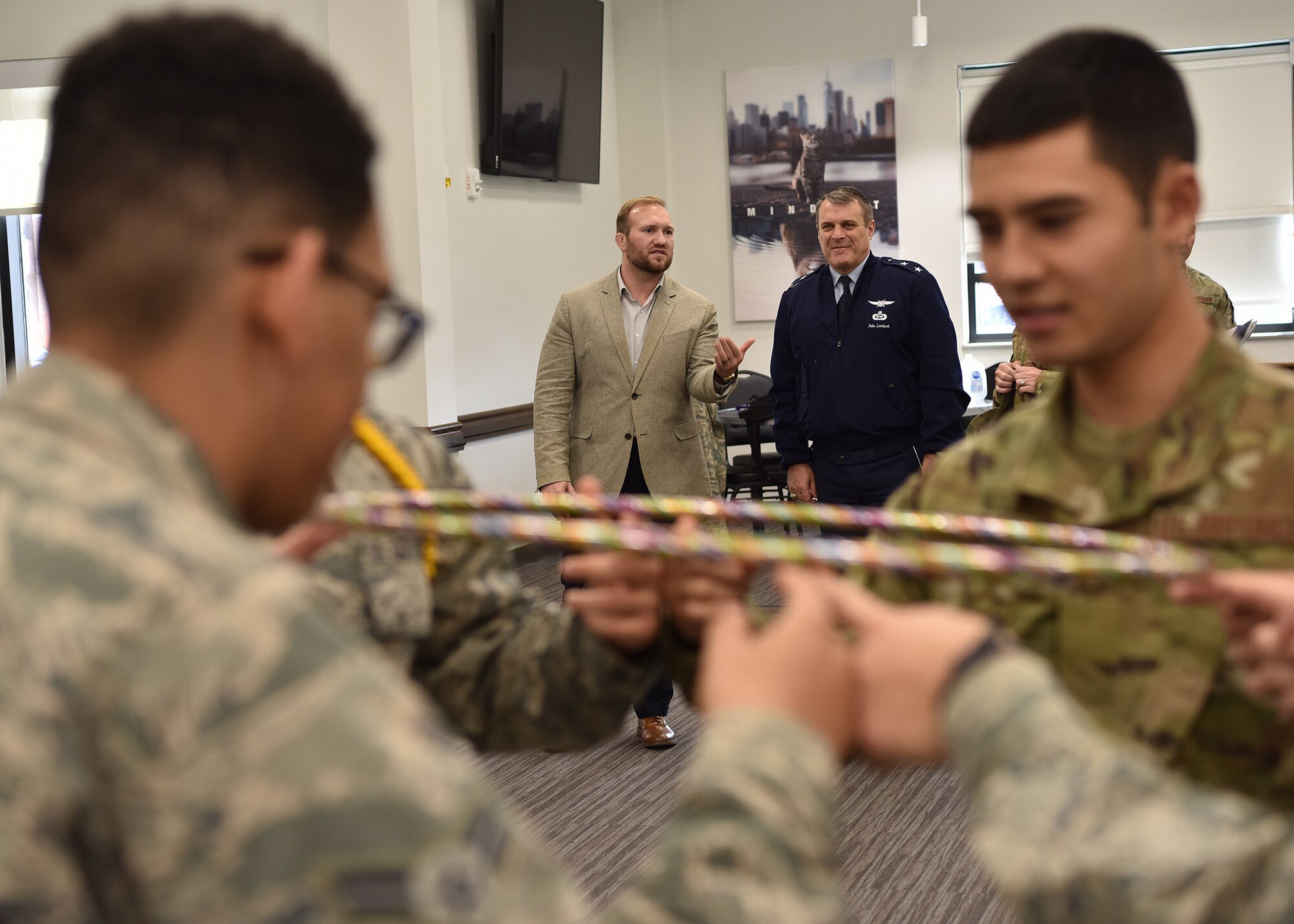 Jeb Clay, 17th Training Support Squadron Airmen Success Model instructor, explains the Mental Fitness Obstacle Course to U.S. Air Force Maj. Gen. Peter Lambert, Assistant Deputy Chief of Staff, Intelligence, Surveillance and Reconnaissance, at the Cressman Student Collaboration Center on Goodfellow Air Force Base, Texas, Feb. 13, 2020. The MFOC is an active learning initiative designed to familiarize service members with performing under stress. (U.S. Air Force photo by Staff Sgt. Chad Warren)