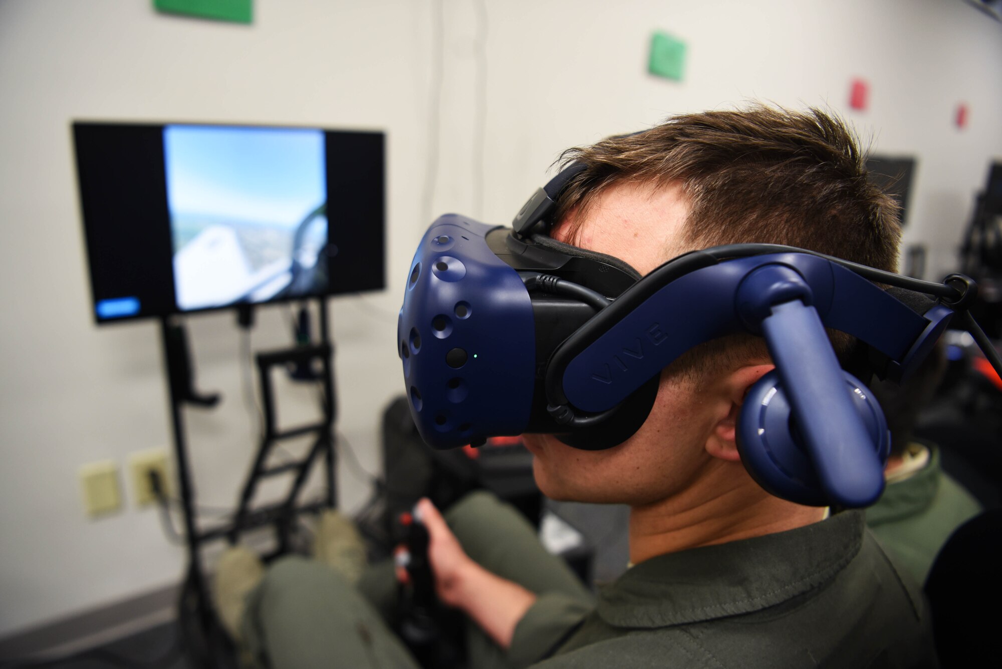 Second Lt. Matthew Demarco, 14th Student Squadron student pilot, looks around with the virtual reality flight simulation equipment strapped on Feb. 11, 2020, on Columbus Air Force Base, Miss. With the help of VR equipment, students see the things they would normally see in an aircraft while being able to follow their procedures as the class instructors provides feedback and grading. (U.S. Air Force photo by Airman 1st Class Jake Jacobsen)