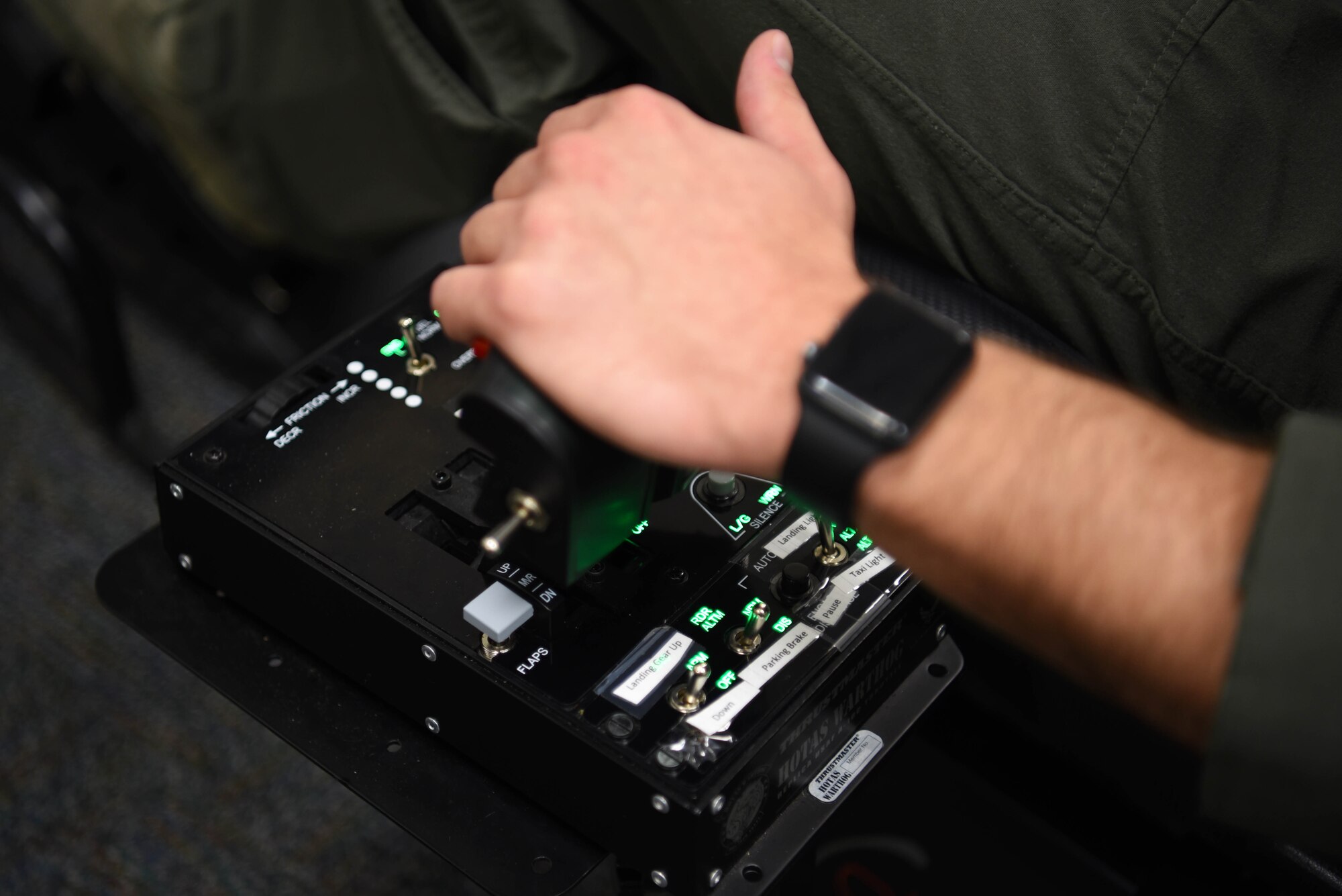 Second Lt. Matthew Demarco, 14th Student Squadron student pilot, adjusts the instruments connected to the virtual reality flight simulator Feb. 11, 2020, on Columbus Air Force Base, Miss. The reason the innovation flight incorporates virtual reality tools such as the Oculus Go into their syllabus is to make pilots more prepared and to help drive the student’s airborne training farther. (U.S. Air Force photo by Airman 1st Class Jake Jacobsen)