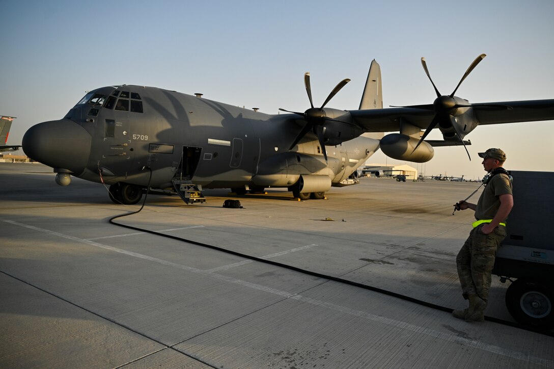 A U.S. Air Force HC-130J Combat King II crew chief with the 79th Expeditionary Rescue Squadron, deployed to Al Udeid Air Base, Qatar, waits to launch an HC-130J before a personnel recovery training mission at Al Udeid AB, Feb. 6, 2020.
