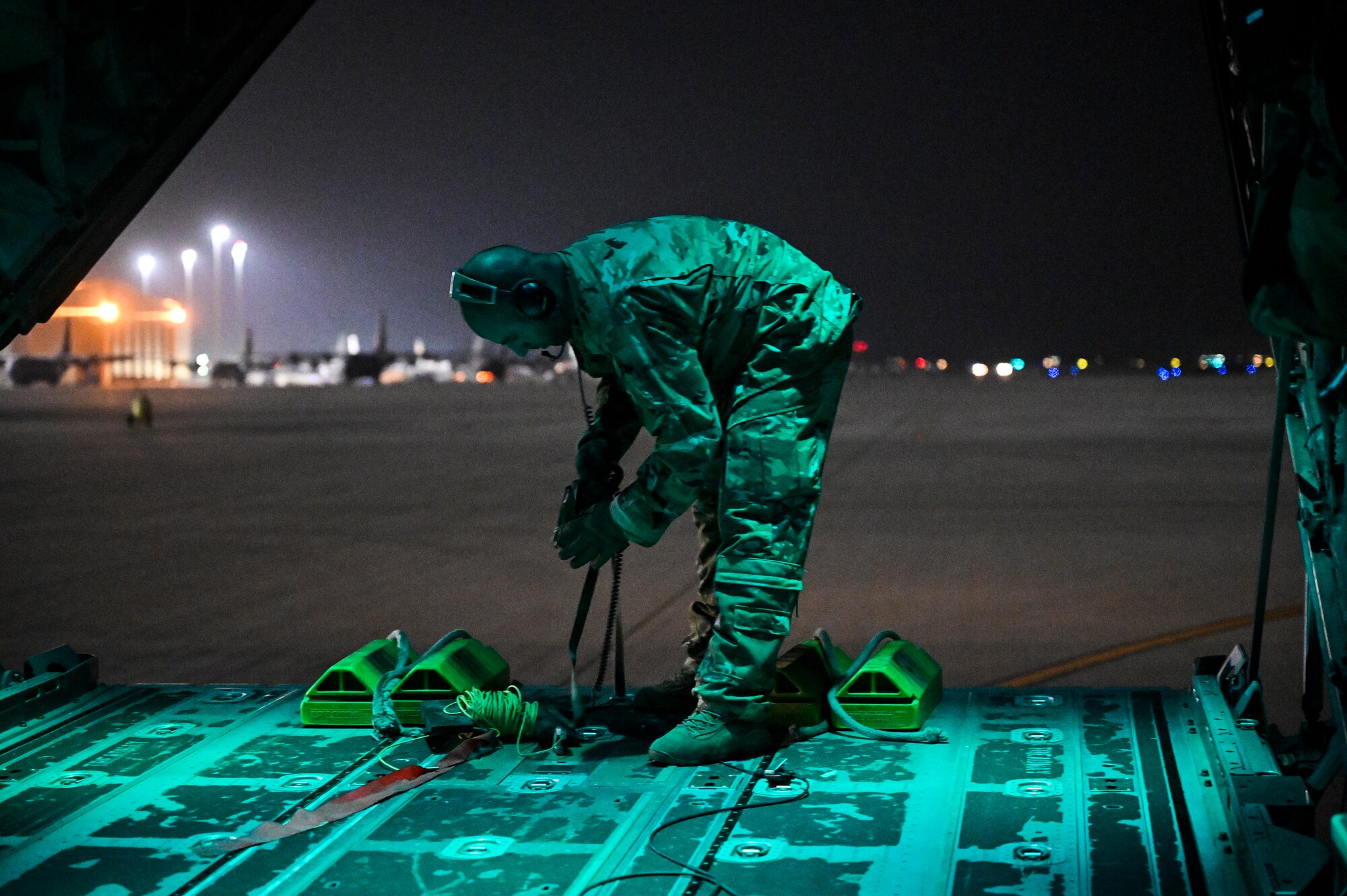 A U.S. Air Force HC-130J Combat King II loadmaster with the 79th Expeditionary Rescue Squadron, deployed to Al Udeid Air Base, Qatar, prepares to park an HC-130J at Al Udeid AB after a personnel recovery training mission, Feb. 6, 2020.