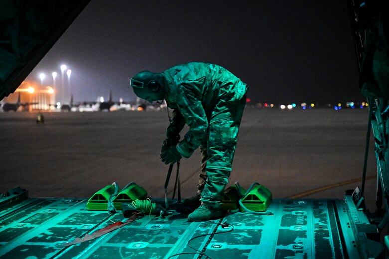 A U.S. Air Force HC-130J Combat King II loadmaster with the 79th Expeditionary Rescue Squadron, deployed to Al Udeid Air Base, Qatar, prepares to park an HC-130J at Al Udeid AB after a personnel recovery training mission, Feb. 6, 2020.