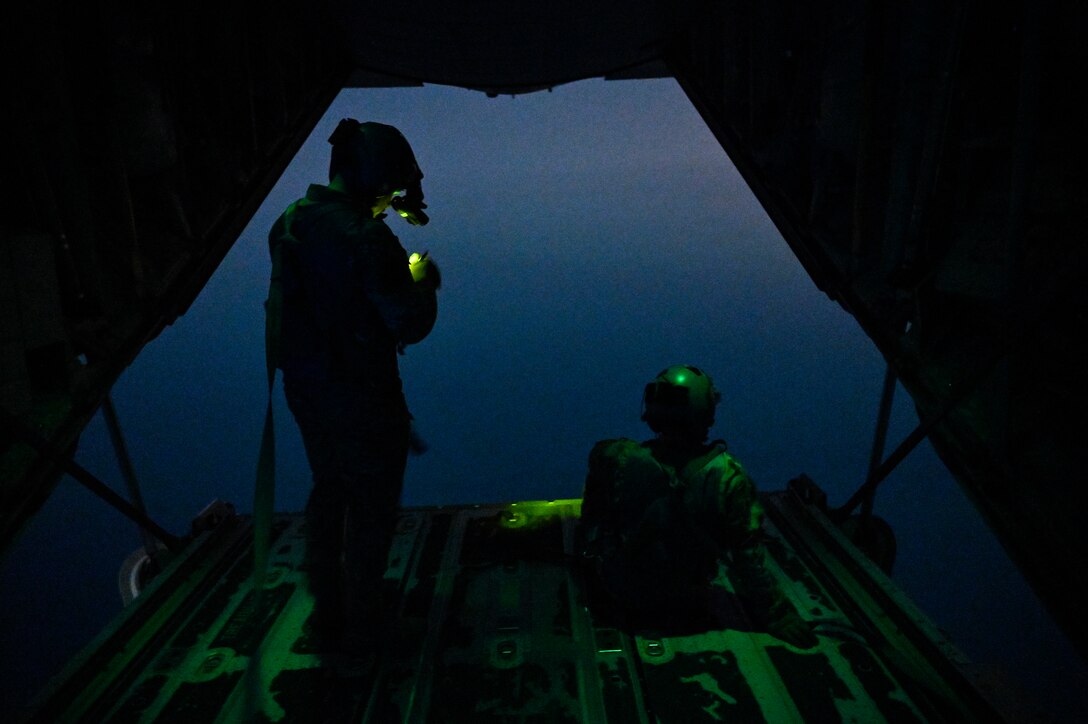 U.S. Air Force HC-130J Combat King II loadmasters with the 79th Expeditionary Rescue Squadron, deployed to Al Udeid Air Base, Qatar, observe their airspace during a personnel recovery training mission over the Arabian Gulf, Feb. 6, 2020.