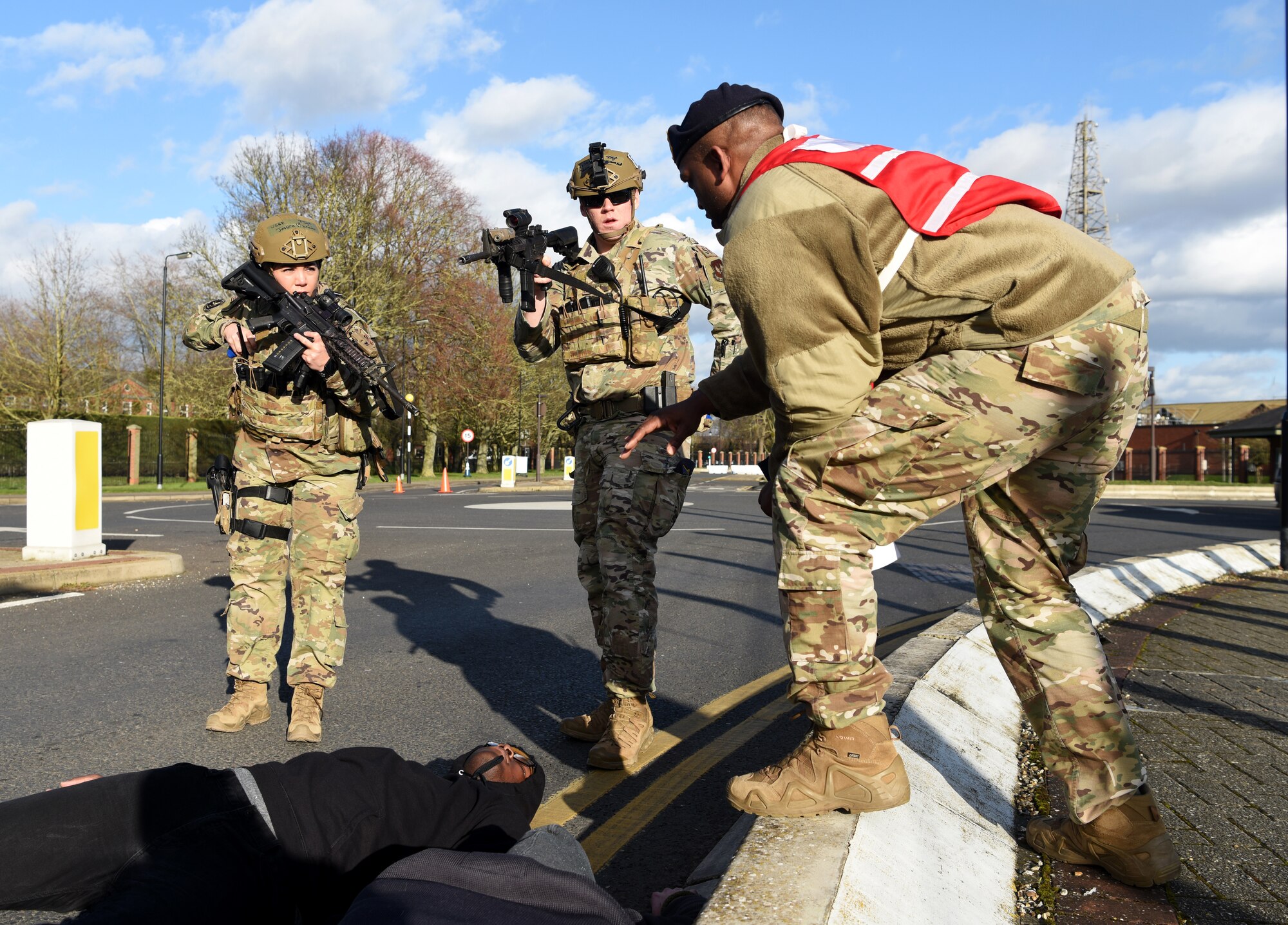Technical Sgt. Jessica Vizcaino, left, 100th Security Forces Squadron flight chief, and Staff Sgt. Shea Sumrall, 100th Security Forces Squadron member, receive instruction from Tech. Sgt. Charles Mitchell, exercise evaluation team member, during a readiness exercise at RAF Mildenhall, England, Feb. 11, 2020. The exercise was performed to test the Bloody Hundredth and sharpen their response and readiness abilities. (U.S. Air Force photo by Senior Airman Brandon Esau)
