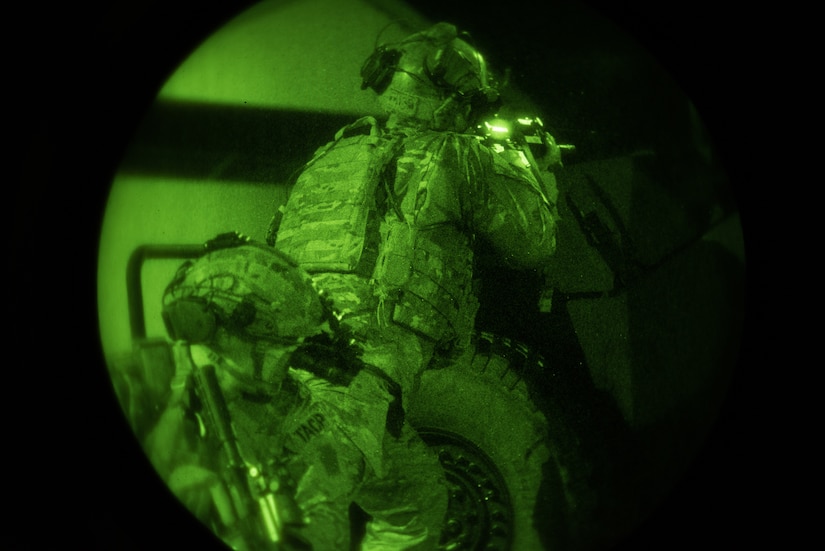 Tactical Air Control Party specialists from the 148th Air Operations Squadron perform night-time training.