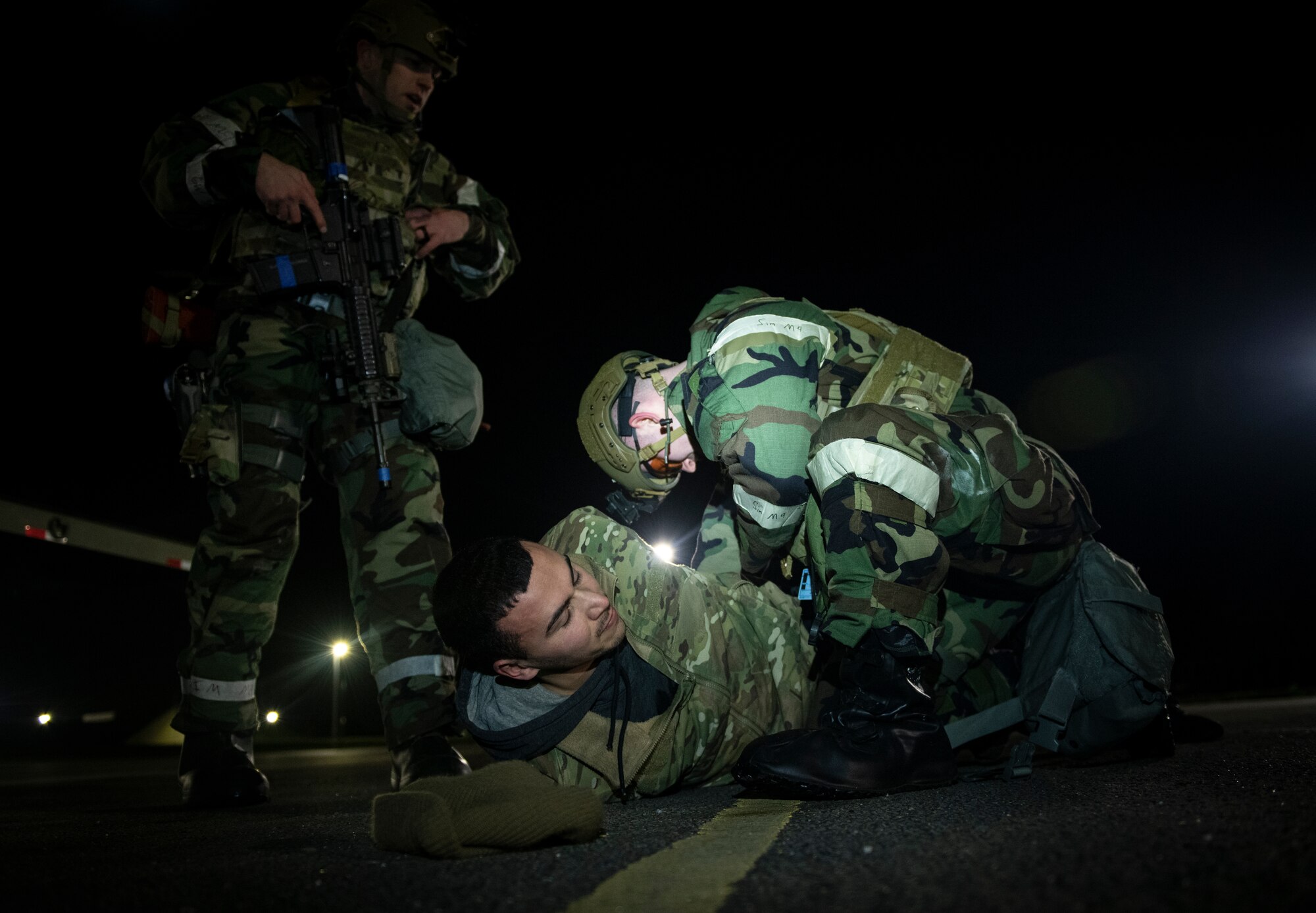 An Airman assigned to the 48th Security Forces Squadron arrests an opposing force during a ‘Furious 48’ exercise at Royal Air Force Lakenheath, England, Feb. 12, 2020. The readiness exercise spans two days and is intended to prepare U.S. Air Force personnel for sustained combat operations during contested and degraded environments. (U.S. Air Force photo by Airman 1st Class Madeline Herzog)