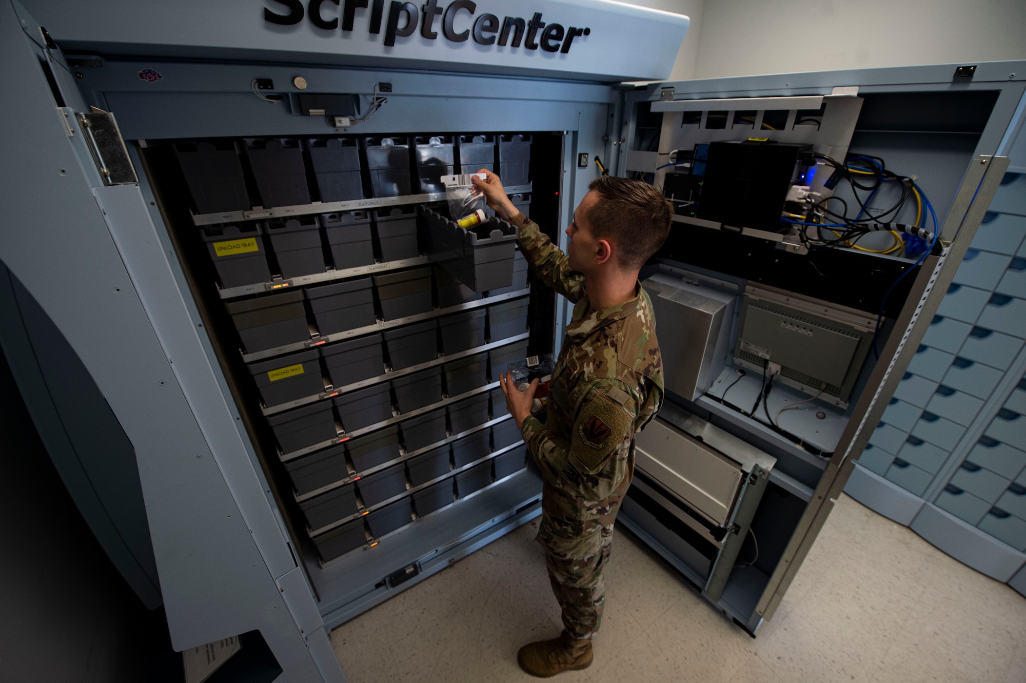 Photo of an Airman delivering prescriptions to the ScriptCenter.