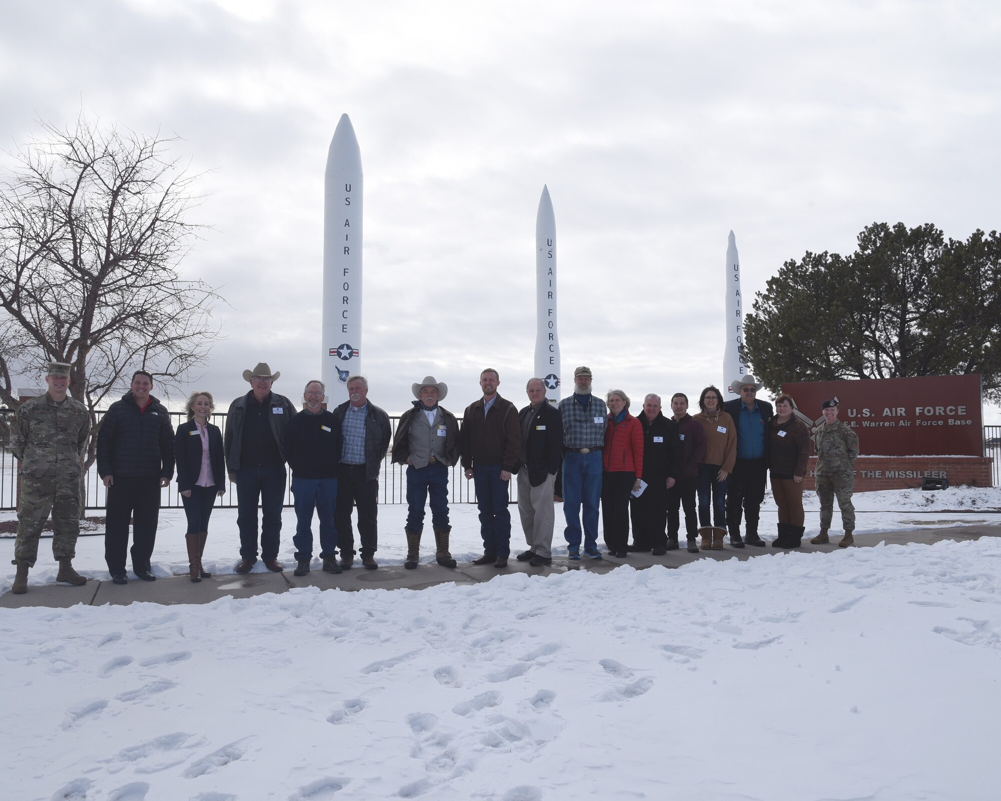 Legislators pose outside base