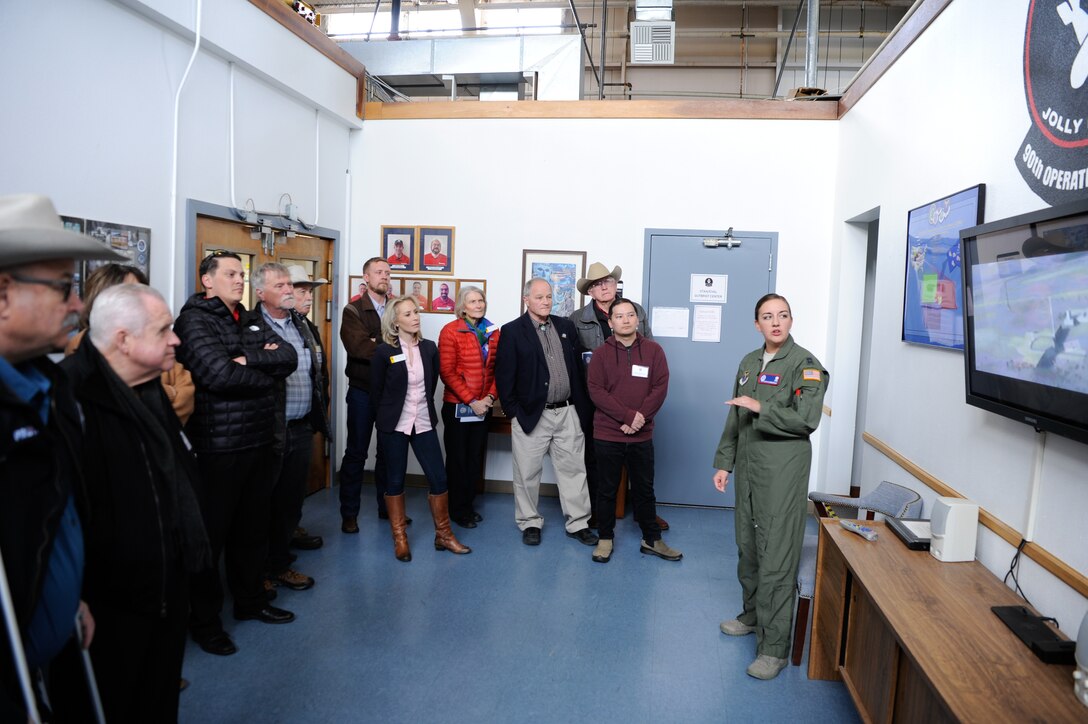 Capt. Sarah Dubuisson briefs state legislators on missile operations during a visit to F. E. Warren Air Force Base, Wyoming, Feb. 7, 2020. The legislators visited the base to learn about the 90th Missile Wing mission and meet Airmen. The representatives and senators saw demonstrations of the missile procedural trainer, missile maintenance trainer, explosive ordnance disposal and security forces. (U.S. Air Force photos by Joseph Coslett)