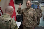 Ohio National Guard Lt. Col. Matt Crawford, deployed as the protection chief in support of Operation Spartan Shield in the Middle East, is sworn in for his next term as veterans service commissioner by Maj. Gen. Gordon L. Ellis, 38th Infantry Division commanding general, Jan. 17, 2020.
