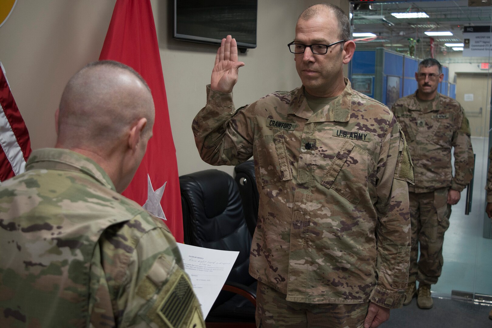 Ohio National Guard Lt. Col. Matt Crawford, deployed as the protection chief in support of Operation Spartan Shield in the Middle East, is sworn in for his next term as veterans service commissioner by Maj. Gen. Gordon L. Ellis, 38th Infantry Division commanding general, Jan. 17, 2020.