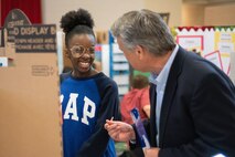 Jonathan Winkler, chief of the Energy Division, U.S. Army Engineering and Support Center, Huntsville, talks to a sixth-grade student during Williams Middle School’s science fair in Huntsville, Alabama, Jan. 30, 2020. Nearly 200 sixth-, seventh- and eighth-graders presented projects at the school’s fair.