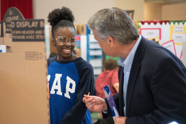 Jonathan Winkler, chief of the Energy Division, U.S. Army Engineering and Support Center, Huntsville, talks to a sixth-grade student during Williams Middle School’s science fair in Huntsville, Alabama, Jan. 30, 2020. Nearly 200 sixth-, seventh- and eighth-graders presented projects at the school’s fair.