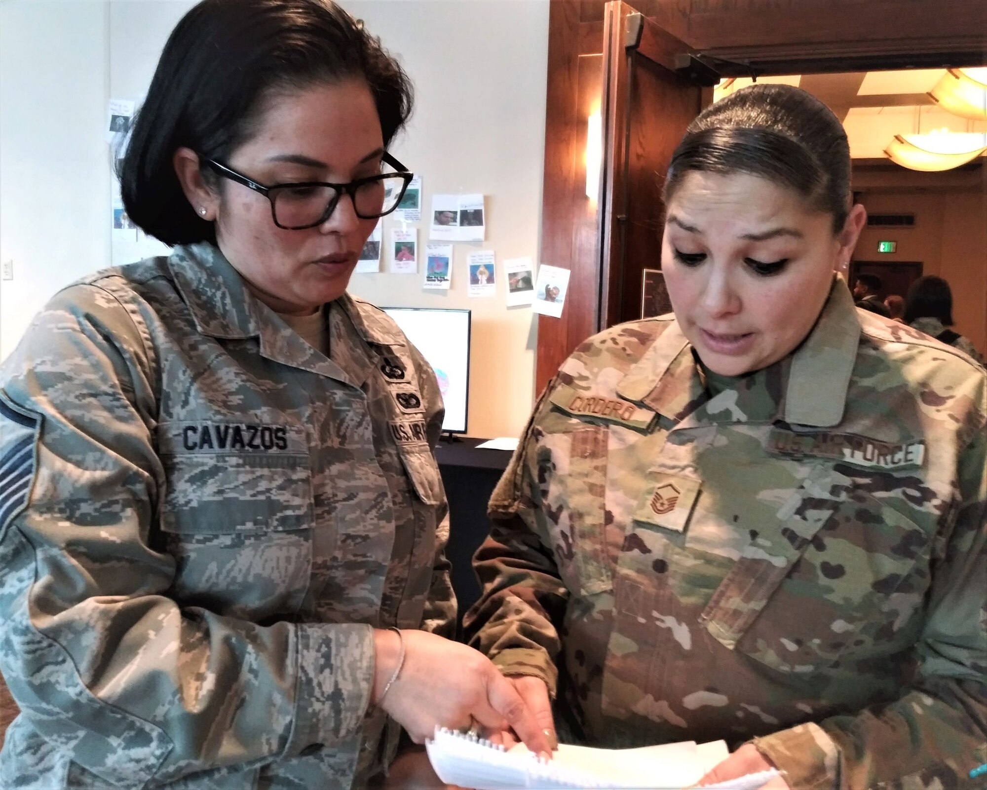Master Sgt. Mariya Cavazos, Financial Services office flight chief at Ellsworth Air Force Base, South Dakota, shares information about a travel pay process with Master Sgt. Sedelia Cordero, financial operations flight chief at Dover Air Force Base, Delaware, during the 2020 Air Force Financial Operations Conference in San Antonio. (Air Force photo by Ed Shannon)