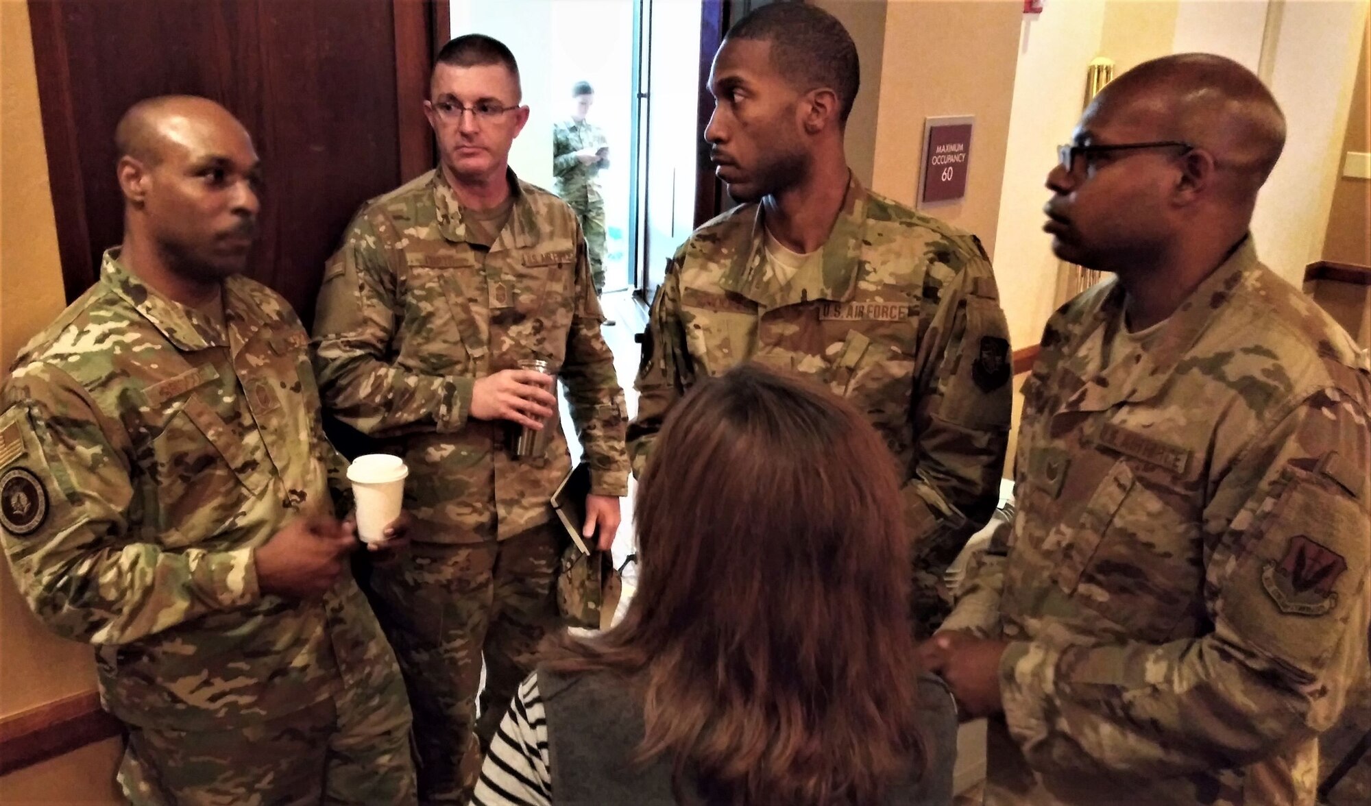 (From left) Chief Master Sgt. Kendall Briscoe, Chief Master Sgt. Chris Coats and Linda Alcala discuss financial operations issues with Staff Sgt. Terrence Troope, Group Resource Advisor, 916 Air Reserve Wing at Seymour-Johnson AFB, North Carolina; and Tech. Sgt. Lawrence Robinson, NCOIC of the 633rd Comptroller Squadron Financial Operations Flight at Joint Base Langley-Eustis, Virginia. Briscoe is the Air Force financial management career field manager, Coats is the Air Education and Training Command financial management chief enlisted manager, and Alcala is AFIMSC's financial operations chief.