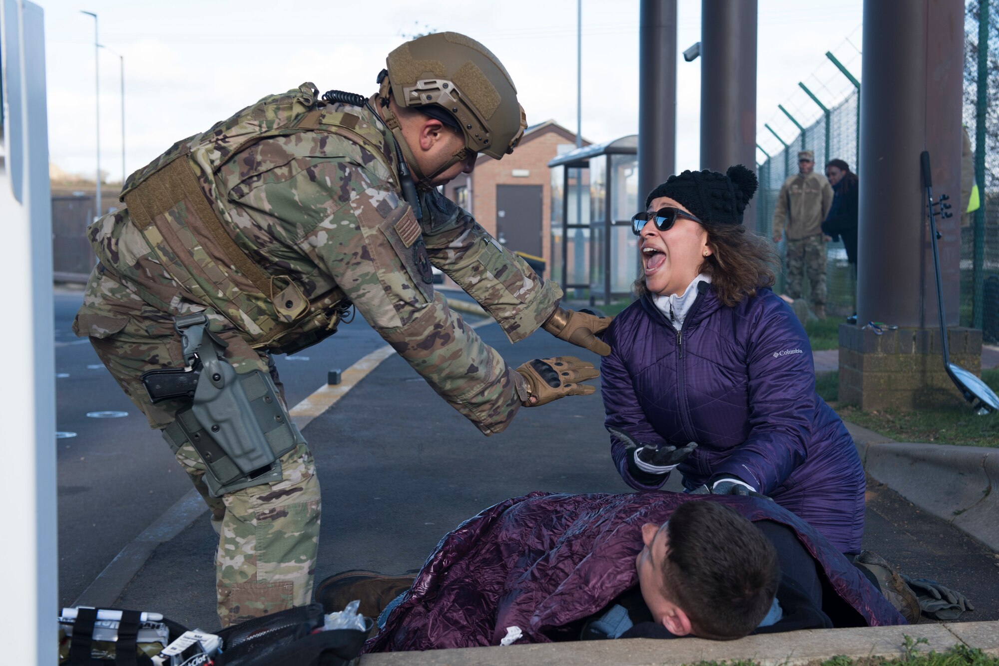 U.S. Air Force Senior Master Sgt. Jason Garo, 422nd Security Forces Squadron defense force operations superintendent, calms a yelling participant who is assisting a simulated casualty during the 501st Combat Support Wing Readiness Exercise 20-01 at RAF Croughton, England, Feb. 12, 2020. The exercise tested the wing’s preparedness and response capabilities to an emergency situation. (U.S. Air Force photo by Airman 1st Class Jennifer Zima)