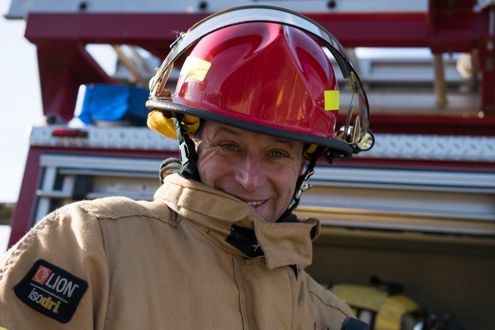 Duncan Fossey, 422nd Civil Engineer Squadron firefighter crew chief, smiles into the camera during the 501st Combat Support Wing Readiness Exercise 20-01 at RAF Croughton, England, Feb. 12, 2020. The exercise tested the wing’s preparedness and response capabilities to an emergency situation. (U.S. Air Force photo by Airman 1st Class Jennifer Zima)