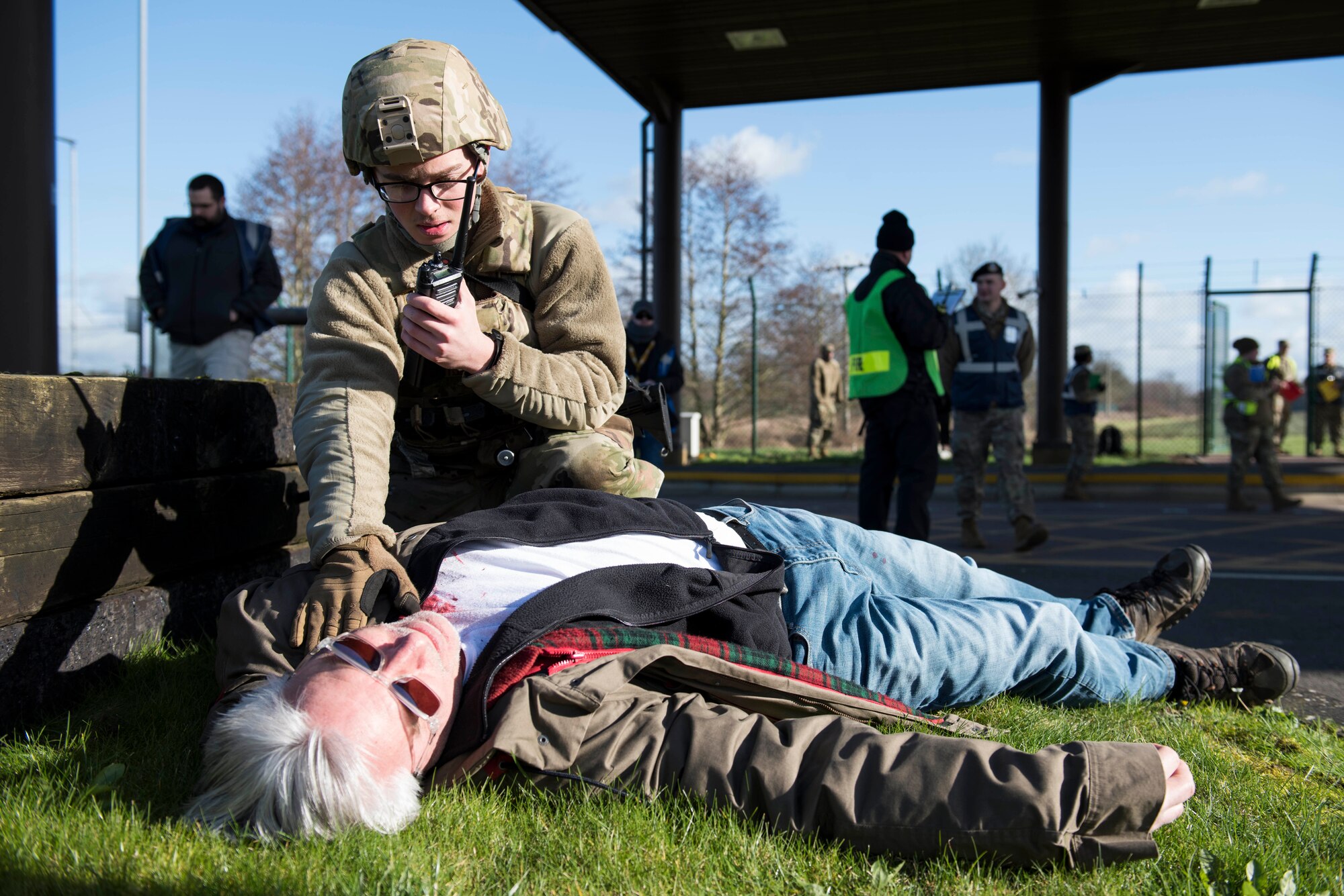 U.S. Air Force Airman 1st Class Graham Stubblefield, 422nd Security Forces Squadron installation entry controller, calls for backup to assist a simulated casualty during the 501st Combat Support Wing Readiness Exercise 20-01 at RAF Croughton, England, Feb. 12, 2020. The exercise tested the wing’s preparedness and response capabilities to an emergency situation. (U.S. Air Force photo by Airman 1st Class Jennifer Zima)