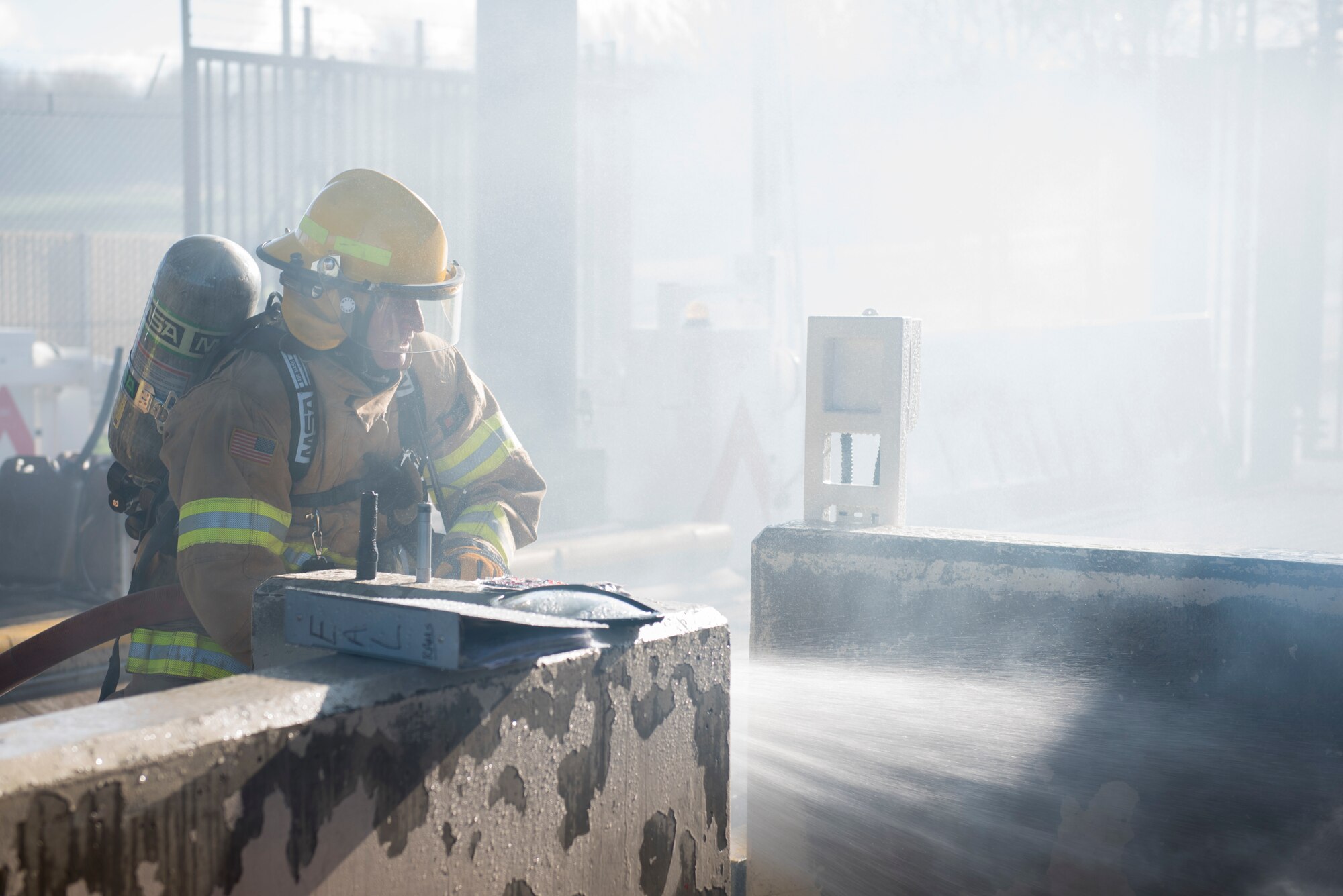 Craig Marsden, 422nd Civil Engineer Squadron firefighter, puts out a simulated fire during the 501st Combat Support Wing Readiness Exercise 20-01 at RAF Croughton, England, Feb. 12, 2020. The exercise tested the wing’s preparedness and response capabilities to an emergency situation. (U.S. Air Force photo by Airman 1st Class Jennifer Zima)