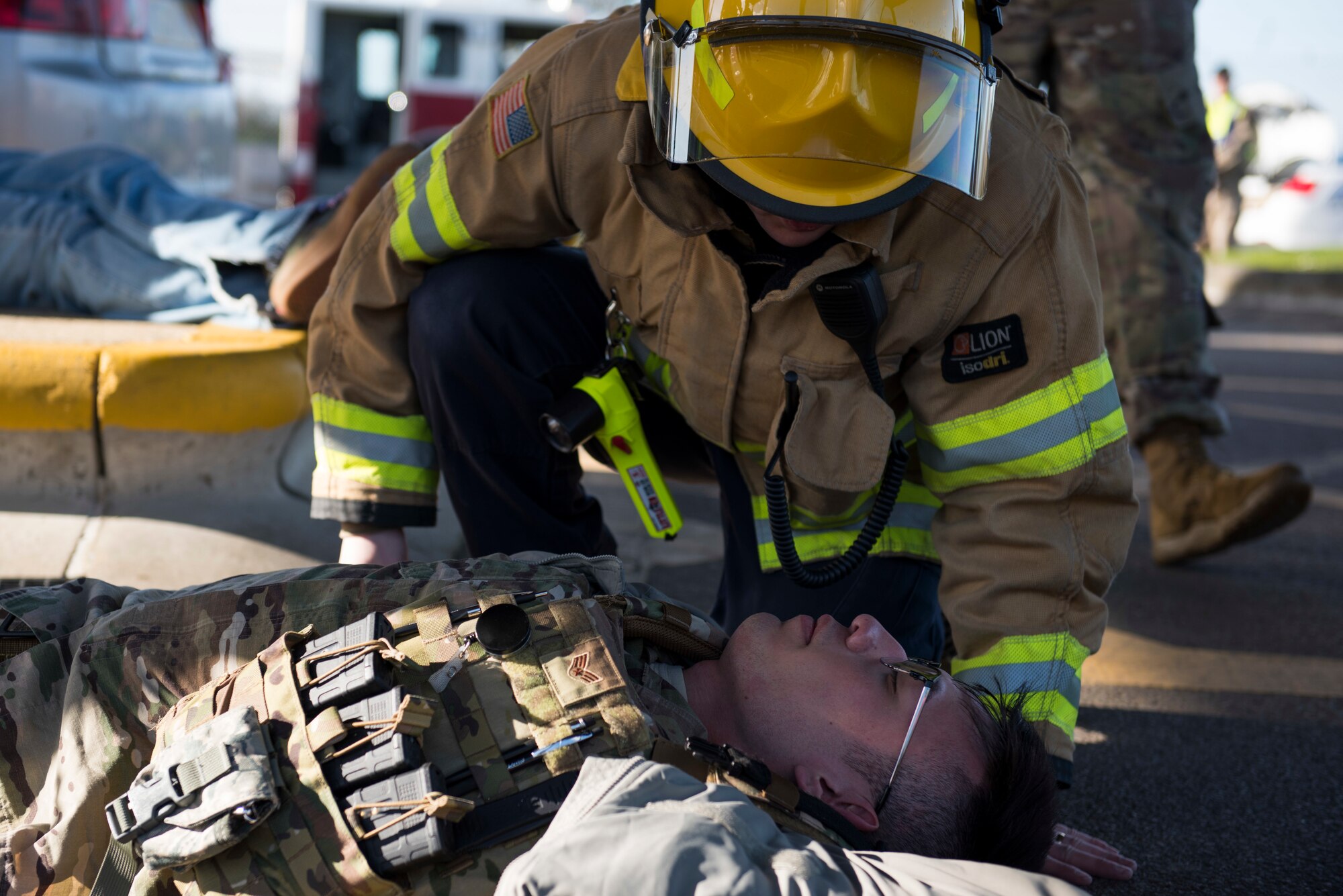 Greg Metheringham, 422nd Civil Engineer Squadron firefighter, assists a simulated casualty during the 501st Combat Support Wing Readiness Exercise 20-01 at RAF Croughton, England, Feb. 12, 2020. The exercise tested the wing’s preparedness and response capabilities to an emergency situation. (U.S. Air Force photo by Airman 1st Class Jennifer Zima)