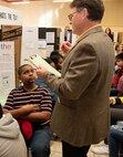 Bruce Railey, a project manager with Global Operations, Ordnance and Explosives Directorate, at the U.S. Army Engineering and Support Center, Huntsville, interviews a sixth-grade student during Williams Middle School’s science fair in Huntsville, Alabama, Jan. 30, 2020. Nearly 200 sixth-, seventh- and eighth-graders presented projects at the school’s fair.