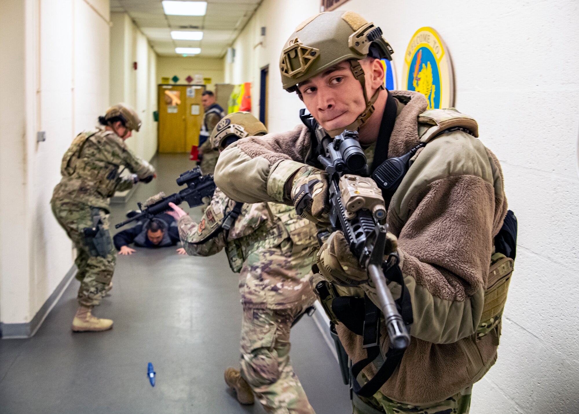 Airmen from the 423d Security Forces Squadron apprehend a simulated suspect during a readiness exercise, at RAF Molesworth, England, Feb. 11, 2020. The exercise tested the wing’s preparedness and response capabilities to an emergency situation. (U.S. Air Force photo by Senior Airman Eugene Oliver)