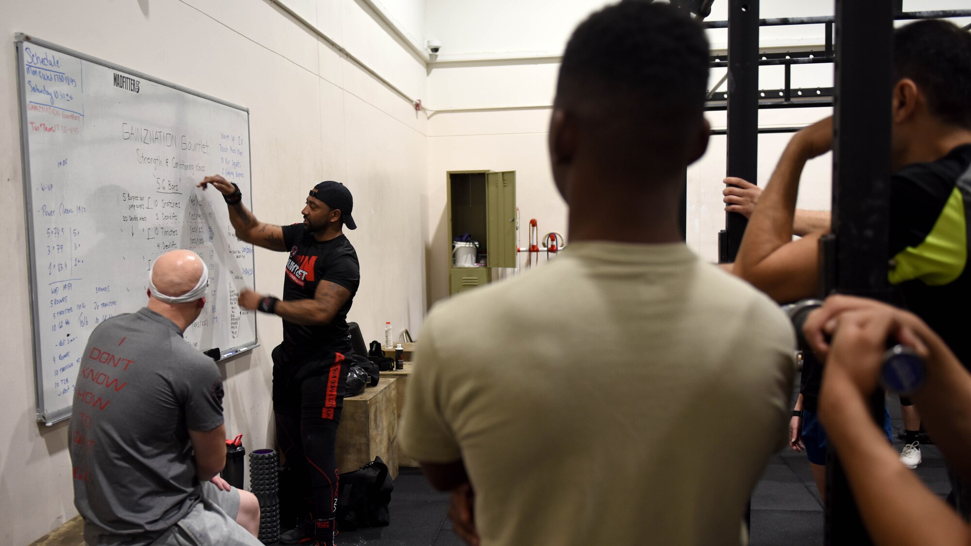 Staff Sgt. Corey Bryant, 39th Security Forces Squadron vault storage area supervisor, goes over a workout plan during his fitness class, at Incirlik Air Base, Turkey, Feb. 6, 2020.