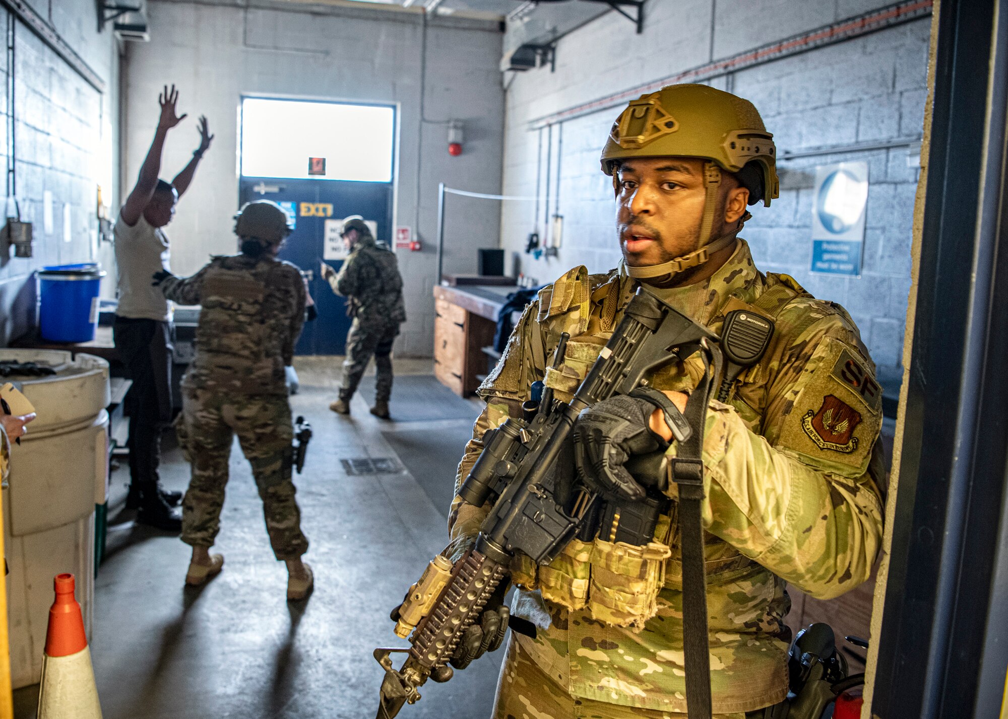 Senior Airman Denzel Hughes, (right) 423d Security Forces Squadron patrolman, secures the area as Airmen from the 423d SFS ensure the safety of simulated victims during a readiness exercise, at RAF Molesworth, England, Feb. 11, 2020. The exercise tested the wing’s preparedness and response capabilities to an emergency situation. (U.S. Air Force photo by Senior Airman Eugene Oliver)