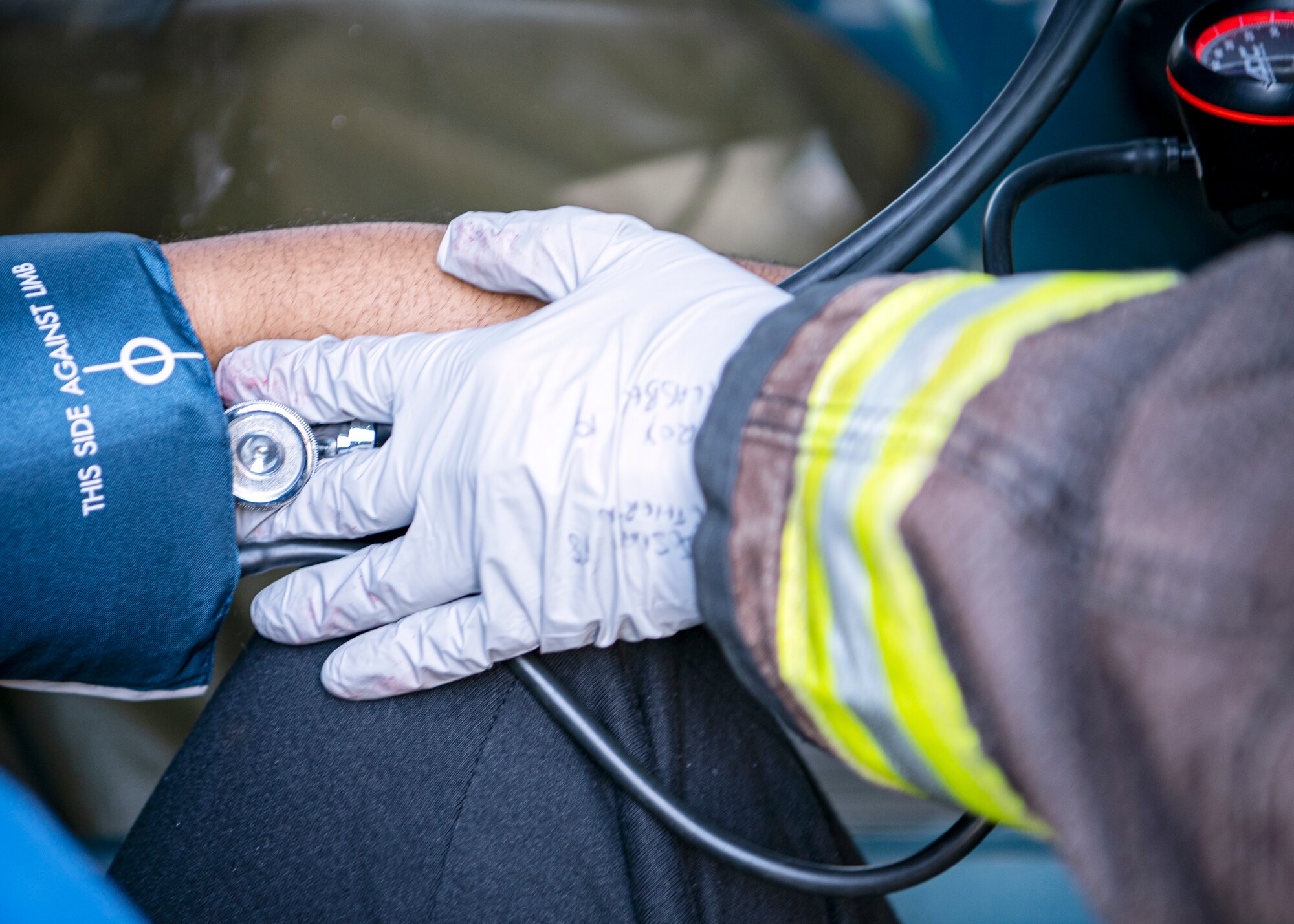 A firefighter from the 423d Civil Engineer Squadron, takes the pulse of a simulated victim, during a readiness exercise, at RAF Molesworth, England, Feb. 11, 2020. The exercise tested the wing’s preparedness and response capabilities to an emergency situation. (U.S. Air Force photo by Senior Airman Eugene Oliver)