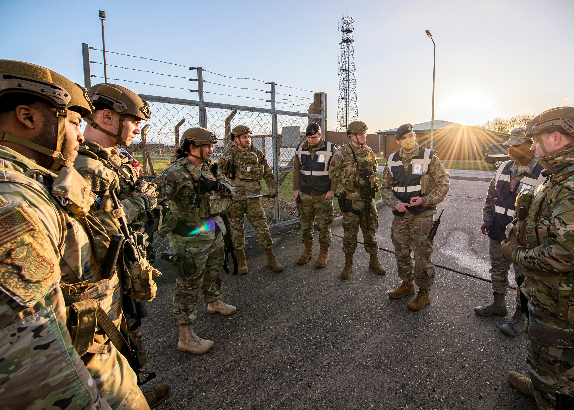 Master Sgt. Travis Beatty, (center right), 501st Combat Support Wing director of exercises for the Inspector General, speaks with Airmen from the 423 Security Forces Squadron about their performance following a readiness exercise, at RAF Molesworth, England, Feb. 11, 2020.  The exercise tested the wing’s preparedness and response capabilities to an emergency situation. (U.S. Air Force photo by Senior Airman Eugene Oliver)
