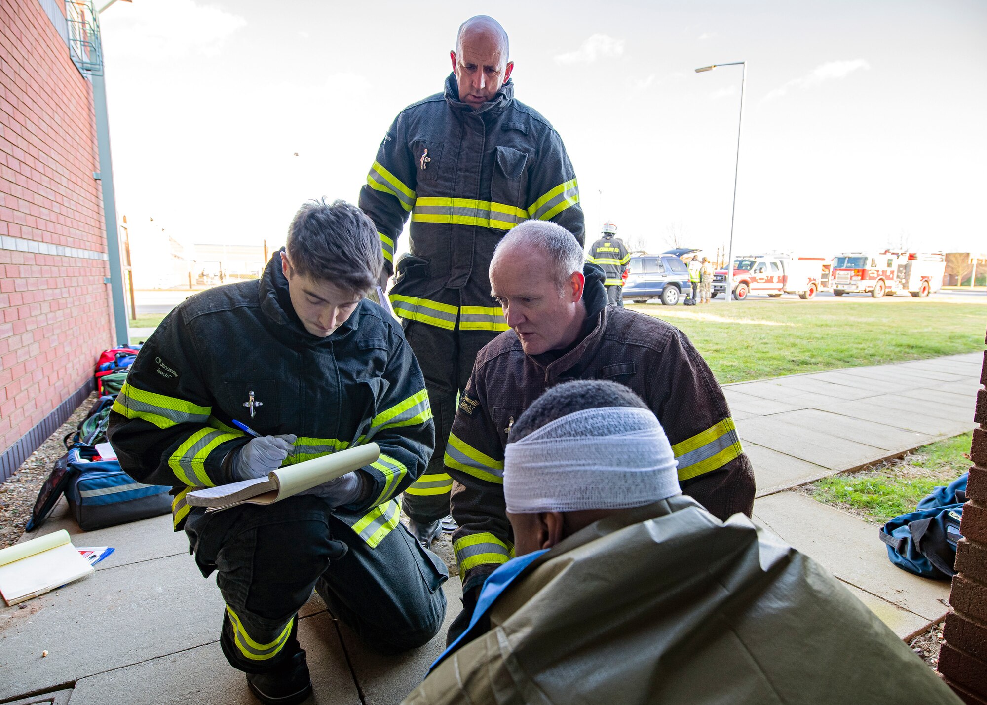 Firefighters from the 422d Civil Engineer Squadron, take vitals from a simulated victim during a readiness exercise, at RAF Molesworth, England, Feb. 11, 2020.  The exercise tested the wing’s preparedness and response capabilities to an emergency situation. (U.S. Air Force photo by Senior Airman Eugene Oliver)