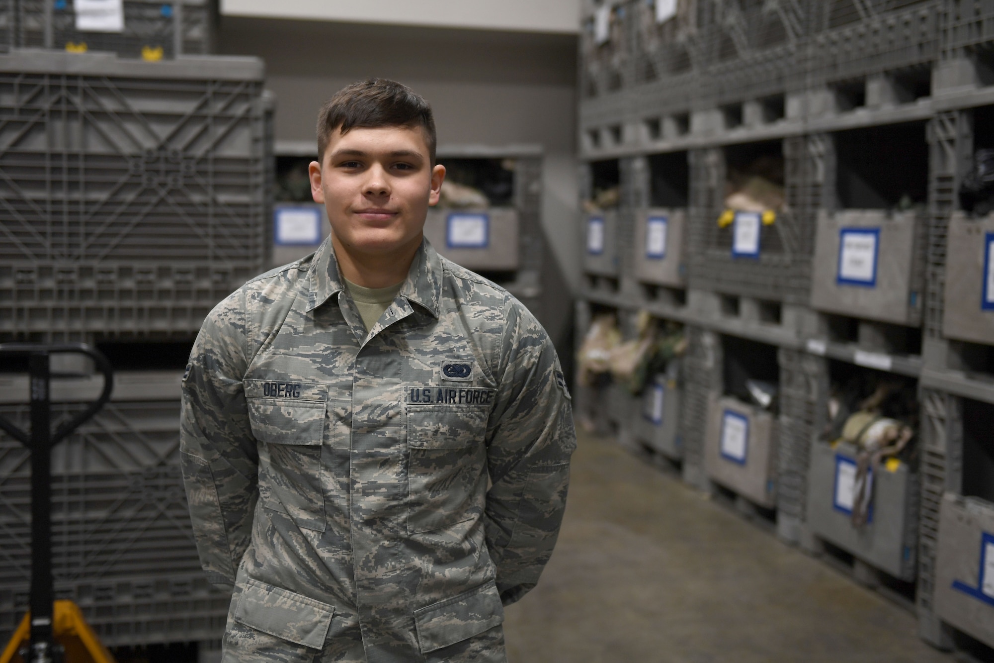 A man stands in a uniform.