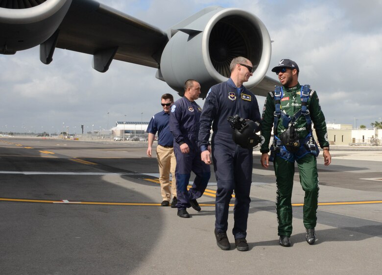 Bubba Wallace, driver of Richard Petty Motorsport's No. 43 car, does a walk around an Air Force C-17 prior to making a grand entrance to this year's Daytona 500 race.