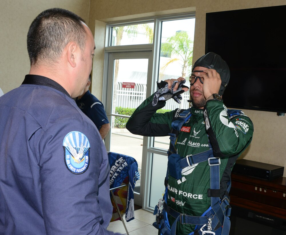 Bubba Wallace, driver of Richard Petty Motorsport’s No. 43 car, gets suited up by a member of the U.S. Wings of Blue prior to making a grand entrance to this year’s Daytona 500 race