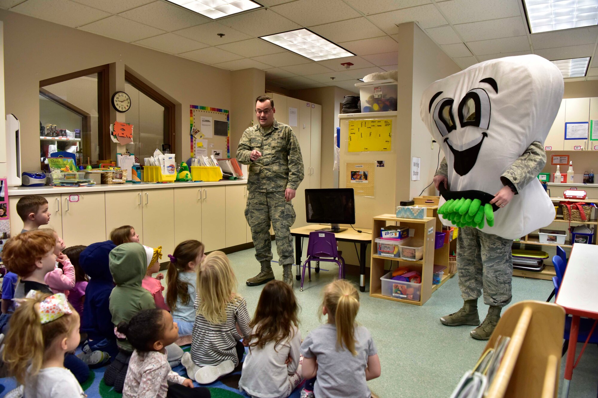 U.S. Air Force Capt. Glen Myers, a 354th Medical Group Dental Flight general dentist, talks to children at the child development center on Eielson Air Force Base, Alaska, Feb. 11, 2020.