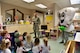 U.S. Air Force Capt. Glen Myers, a 354th Medical Group Dental Flight general dentist, talks to children at the child development center on Eielson Air Force Base, Alaska, Feb. 11, 2020.