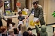 U.S. Air Force Capt. Glen Myers, a 354th Medical Group Dental Flight general dentist, hands out gift bags at the child development center on Eielson Air Force Base, Alaska, Feb. 11, 2020.