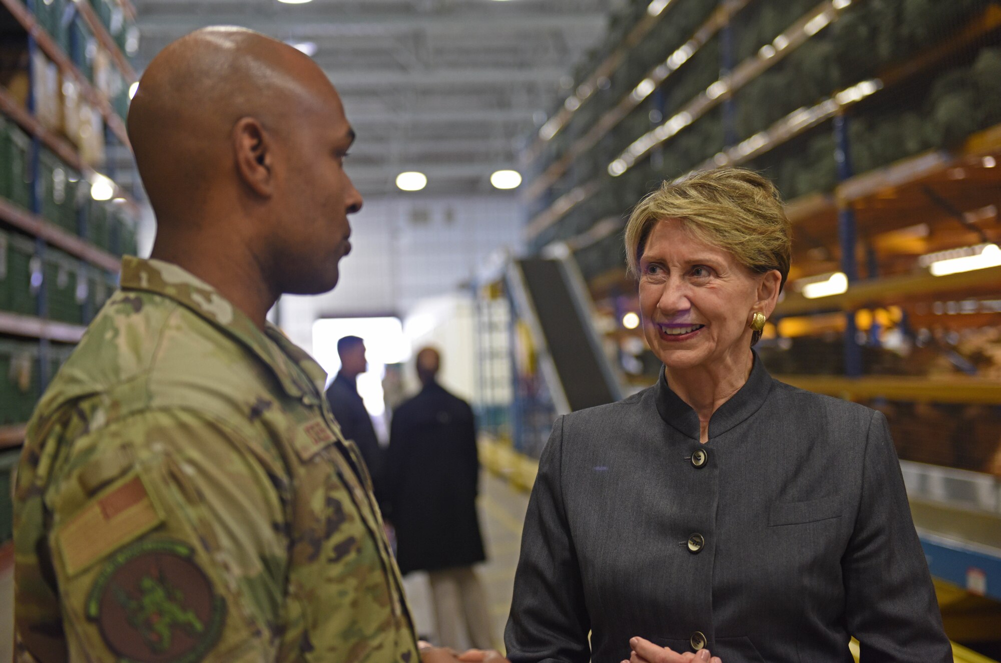 Tech. Sgt. Ralph Steele, 100th Logistics Readiness Squadron section chief of plans and integration, speaks to Secretary of the Air Force Barbara Barrett during her visit to RAF Mildenhall, England, Feb. 13, 2020. Barrett’s visit to RAF Mildenhall was her first as the 25th Secretary of the Air Force. (U.S. Air Force photo by Staff Sgt. Luke Milano)