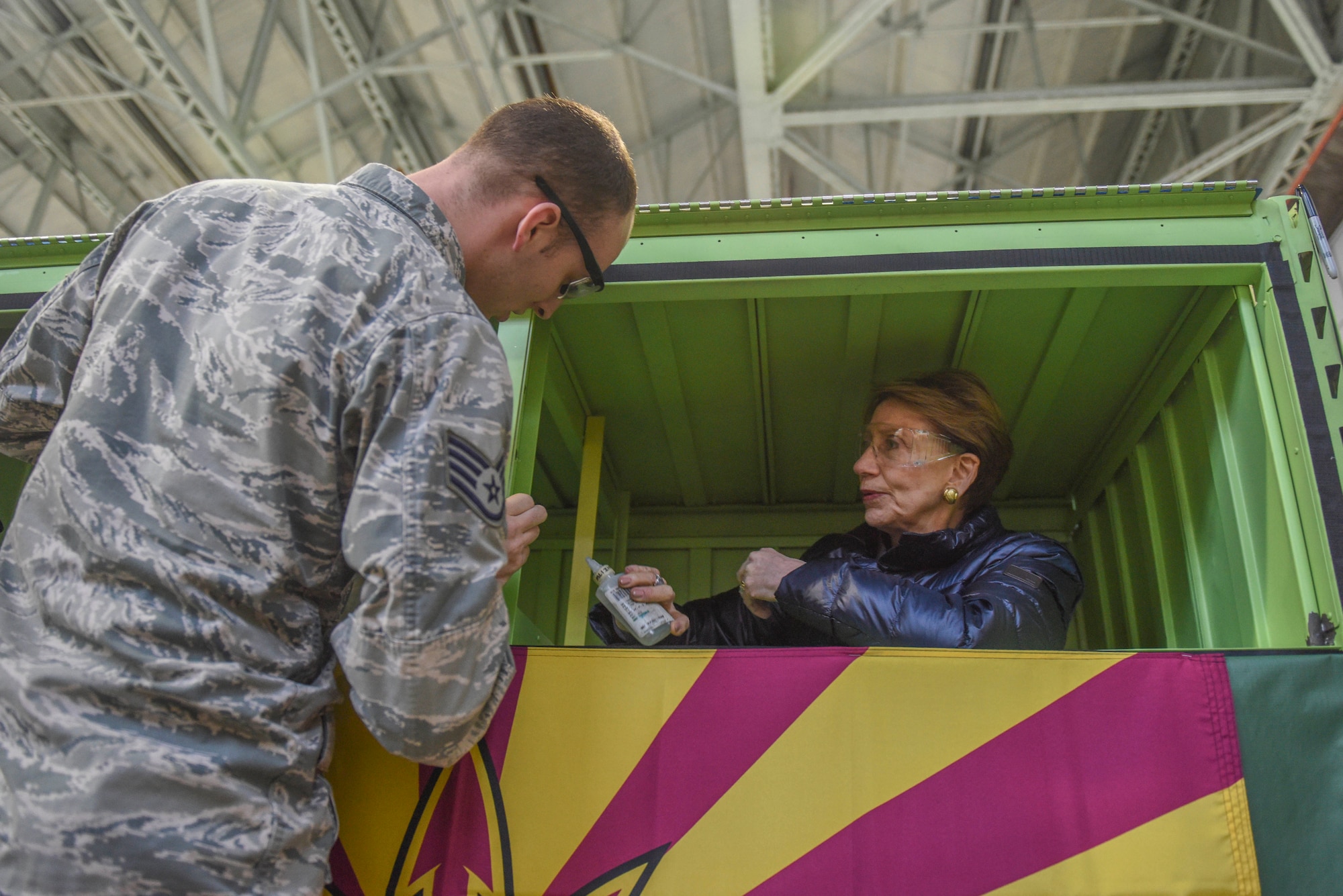 Secretary of the Air Force Barbara Barrett performs maintenance training as Staff Sgt. Patrick Leach, 100th Maintenance Squadron aircraft fuels systems craftsman, explains the unit’s fuel-cell trainer keeps Airmen proficient at their job, during her visit to RAF Mildenhall, England, Feb. 13, 2020. During Barrett’s visit she engaged with RAF Mildenhall Airmen about Team Mildenhall’s mission, Air Force modernization and readiness. (U.S. Air Force photo by Staff Sgt. Luke Milano)