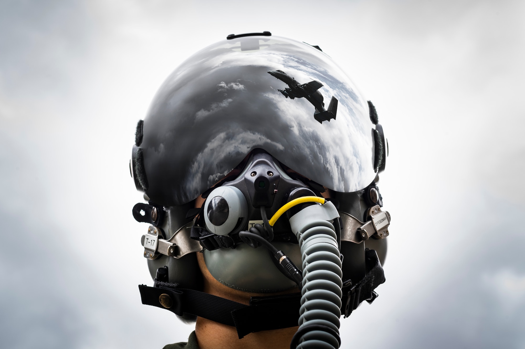 A photo illustration of a pilot wearing a helmet