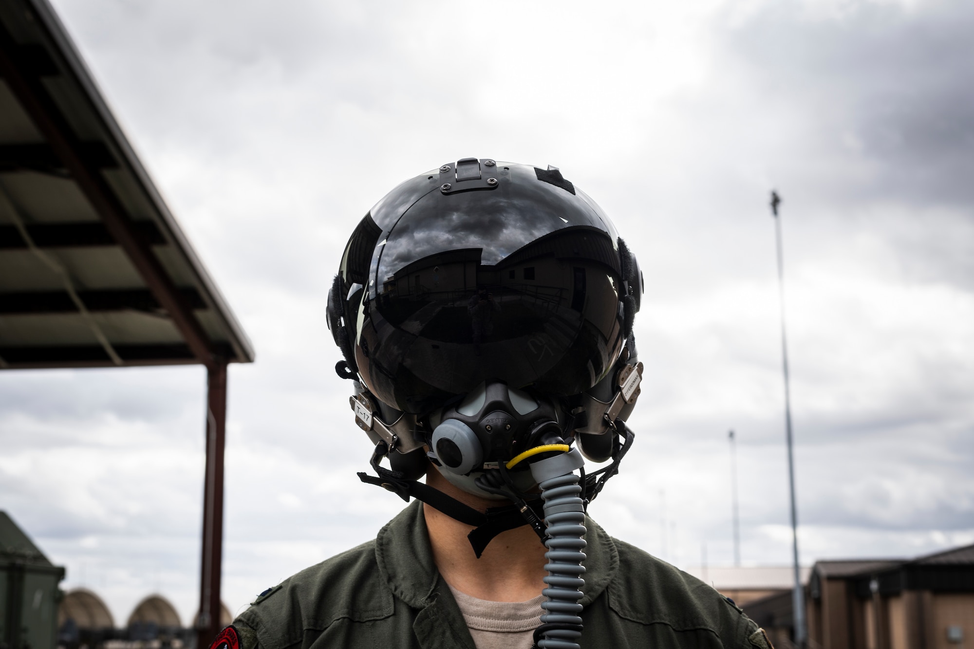 A photo of a pilot wearing a helmet