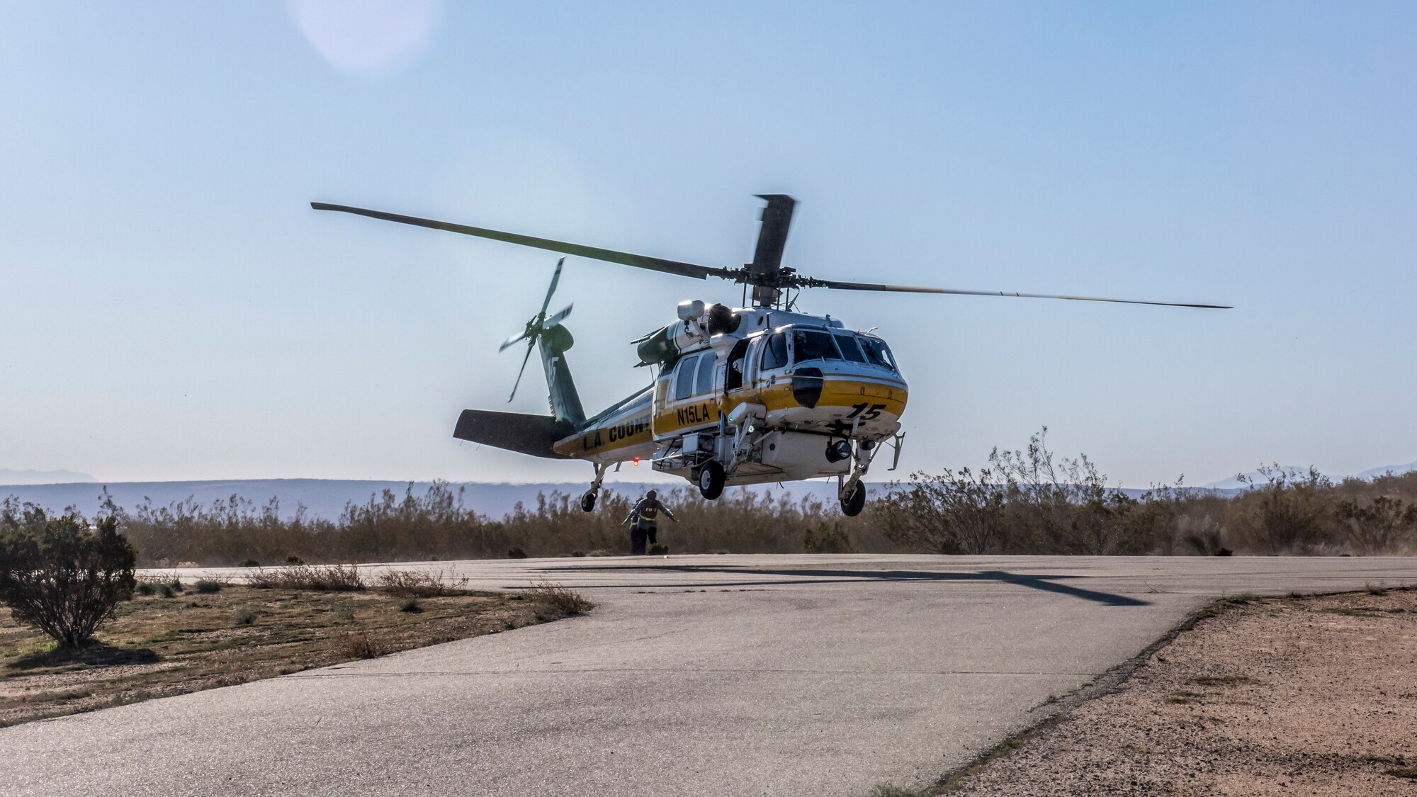 A helicopter from the Los Angeles County Fire Department lands near the base clinic during an active shooter exercise at Edwards Air Force Base, California, Feb. 11. The victims were transported to the Antelope Valley Hospital in nearby Lancaster, California. (Air Force photo by Richard Gonzales)