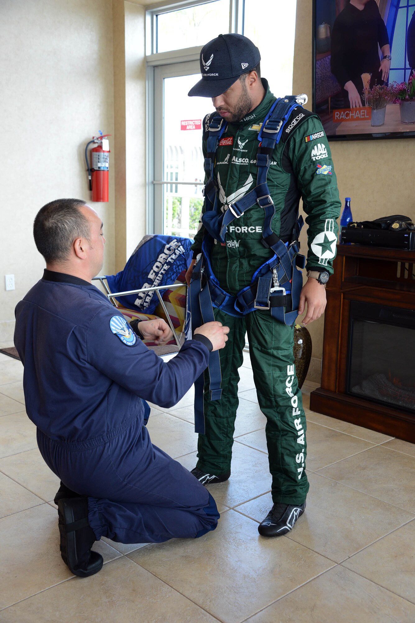 Bubba Wallace, driver of Richard Petty Motorsport’s No. 43 car, gets suited up by a member of the U.S. Wings of Blue prior to making a grand entrance to this year’s Daytona 500 race.